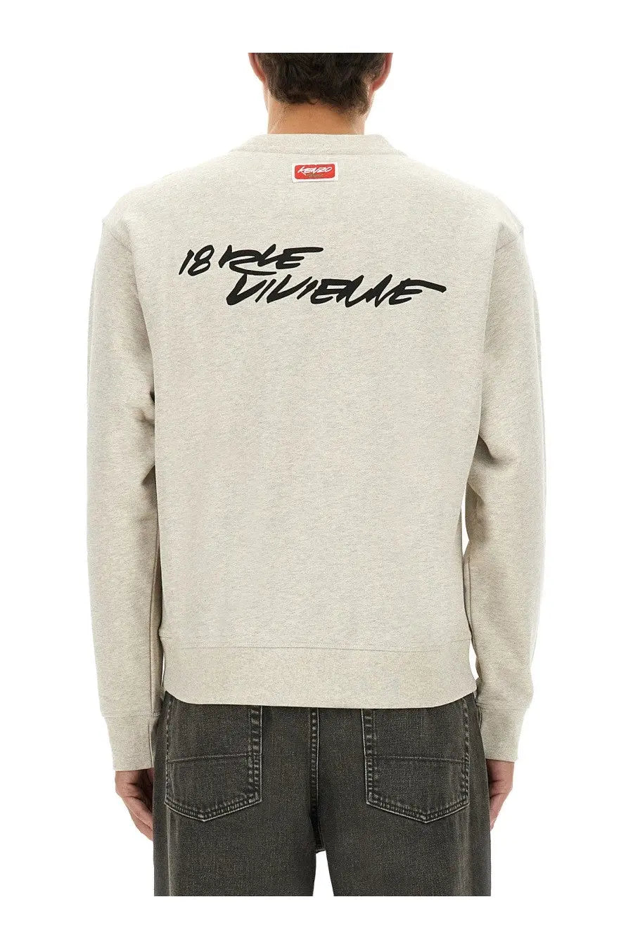 Back view of kenzo men’s classic sweatshirt grey heather gray with black cursive 18 rue dunne lettering and red brand tag