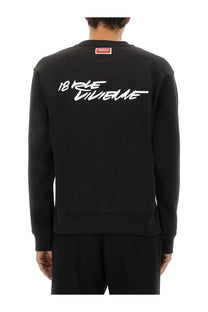 Back of black kenzo men’s cotton crewneck sweatshirt with white 18 rue divine script and small red logo at neckline