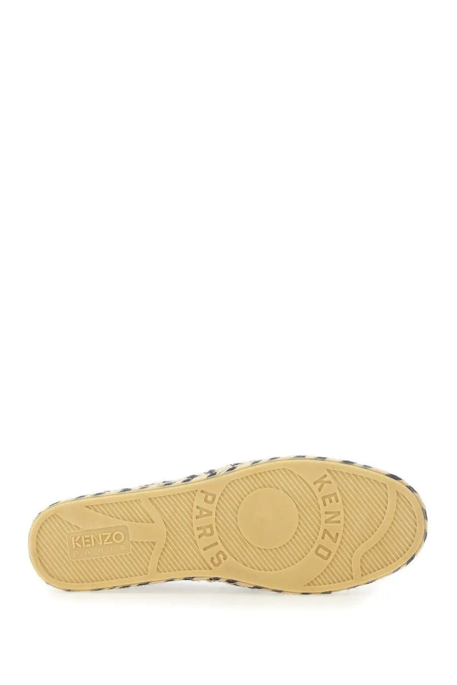 Tan rubber sole with black and white striped edge and embossed kenzo paris branding on kenzo men’s espadrilla purple