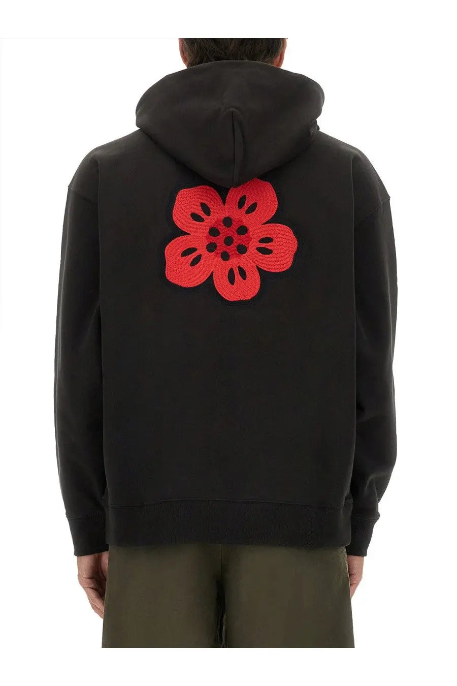 Back side of kenzo men’s black hoodie featuring a bold red embroidered flower on the cotton fabric