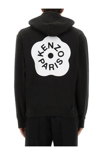 Kenzo men’s black hoodie with bold white floral logo and black brand name lettering on the front