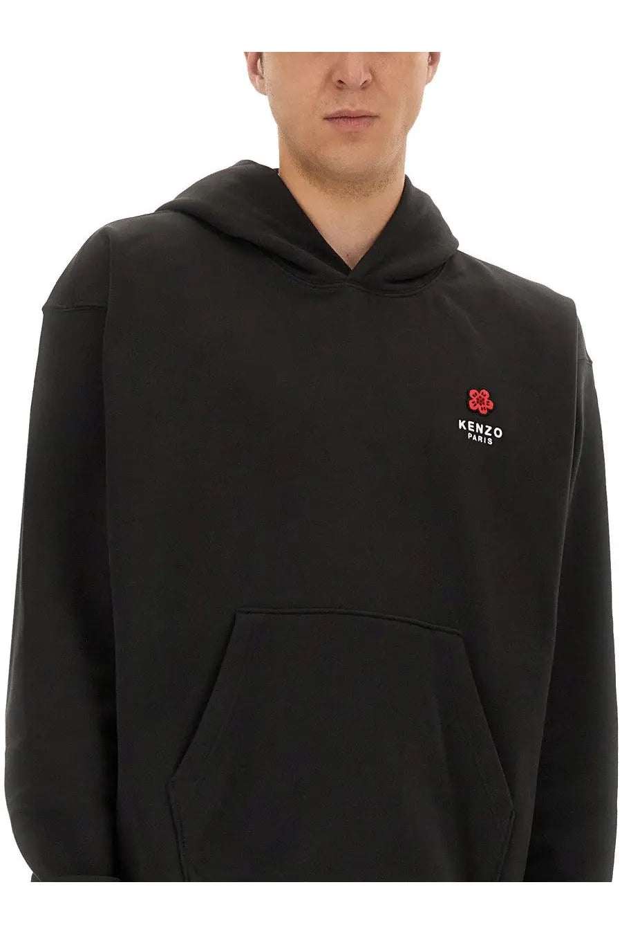 Kenzo men’s black hoodie featuring a red floral logo and white text on the left chest in cotton material