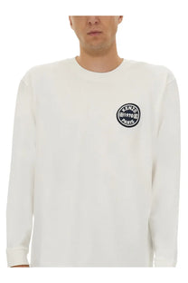 Kenzo men’s white long sleeved crewneck shirt with black circular embroidered logo on left chest
