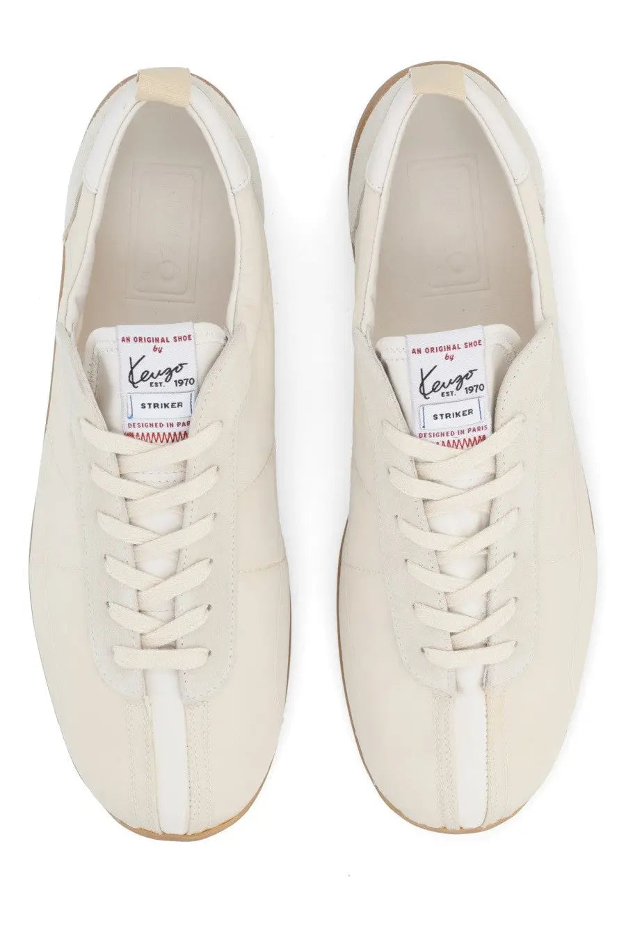 Cream-colored leather kenzo men’s striker sneakers with a white side stripe and red stitching on the tongue label