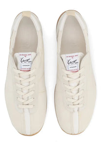 Cream-colored leather kenzo men’s striker sneakers with a white side stripe and red stitching on the tongue label
