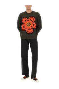 Kenzo men’s dark green knit sweater with bold orange floral design black accents and yellow geometric center