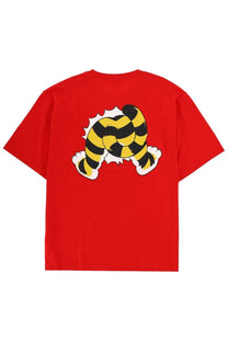 Kenzo men’s red short-sleeved t-shirt with bold yellow and black striped tiger legs graphic bursting through fabric