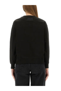 Kenzo women’s black cotton sweatshirt with a subtle logo embroidered at the neckline