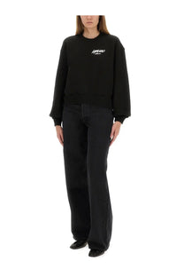 Kenzo women’s black oversized sweatshirt with white embroidered logo on chest in soft cotton blend material