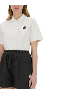 Kenzo women’s white short-sleeved polo shirt with black embroidered boke flower logo on the chest