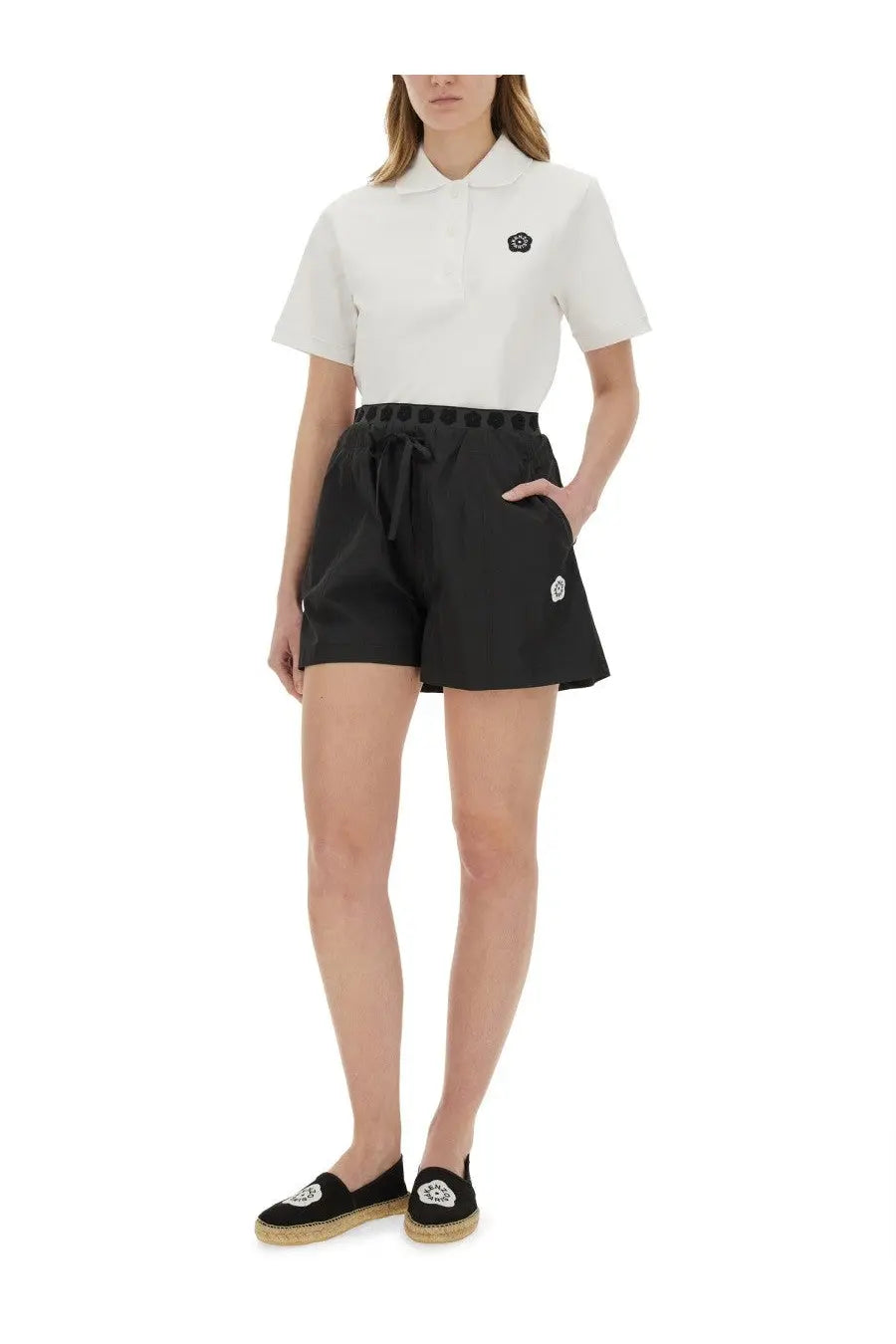 Kenzo women’s white short-sleeved polo shirt with black embroidered logo on chest in breathable cotton fabric