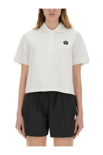 Kenzo women’s white short-sleeved polo shirt featuring black embroidered logo on left chest for casual wear