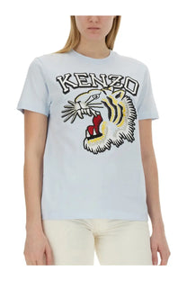 Kenzo women’s light blue t-shirt with bold embroidered tiger featuring black stripes white fur accents and red tongue
