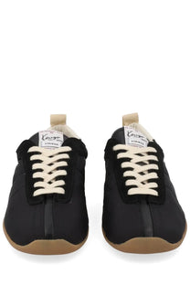 Kenzo women’s Kenzo striker sneaker black with cream-colored laces and gum rubber sole in sneaker design