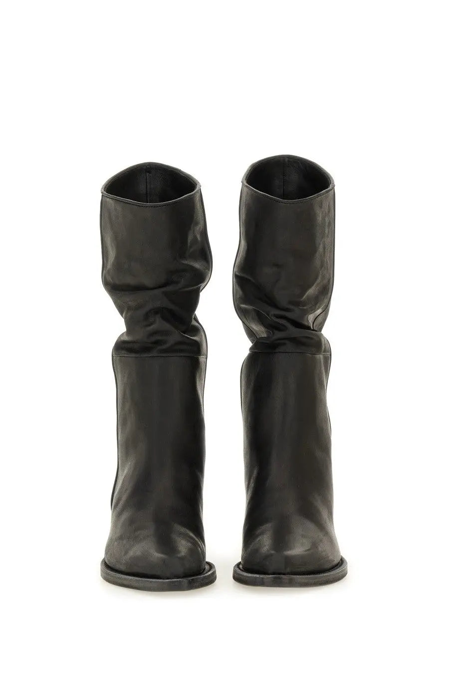 Khaite women’s black leather ankle boots with slouchy upper and square toe in the front view