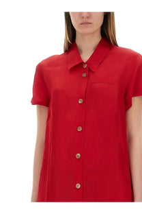 Khaite women’s effy dress red featuring a vibrant red short-sleeved button-up shirt with classic collar and wooden buttons