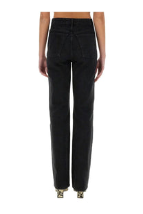 Back view of khaite women’s black high-waisted straight-leg denim jeans with classic back pocket design