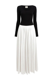Khaite women’s long dress Carlotta multicolor featuring a black long-sleeved top and white pleated skirt