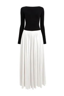 Khaite women’s long dress carlotta featuring a black long-sleeved top with white pleated skirt front view