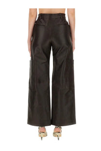 Khaite women’s black faux leather cargo pants with wide legs and large side pockets in the caiton brown style