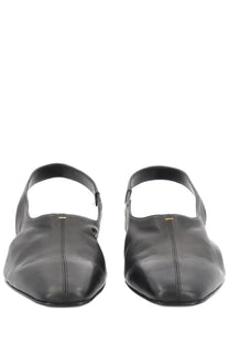 Khaite women’s shoe Celia black leather slingback flats with minimalist design and subtle gold stitching