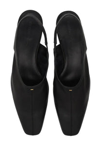Khaite women’s celia black leather slingback heels with a sleek minimalist design and gold-tone hardware at the toe