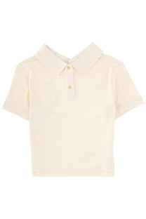 Cream-colored short-sleeved polo shirt with classic collar and two gold-toned buttons by Khaite Women Jasna White