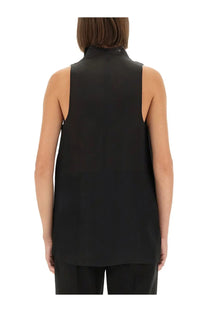 Khaite women’s black sleeveless top with high neckline and smooth flowing fabric perfect for stylish layering