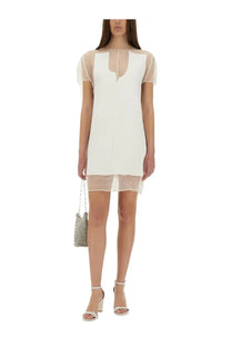 Khaite women’s Winona dress in white with sheer mesh sleeves and a layered hemline design