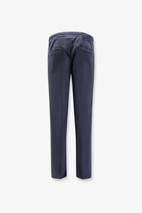 Back view of kiton men’s dark blue lyocell blend slim-fit trousers with stretchy elastic waistband and two back pockets