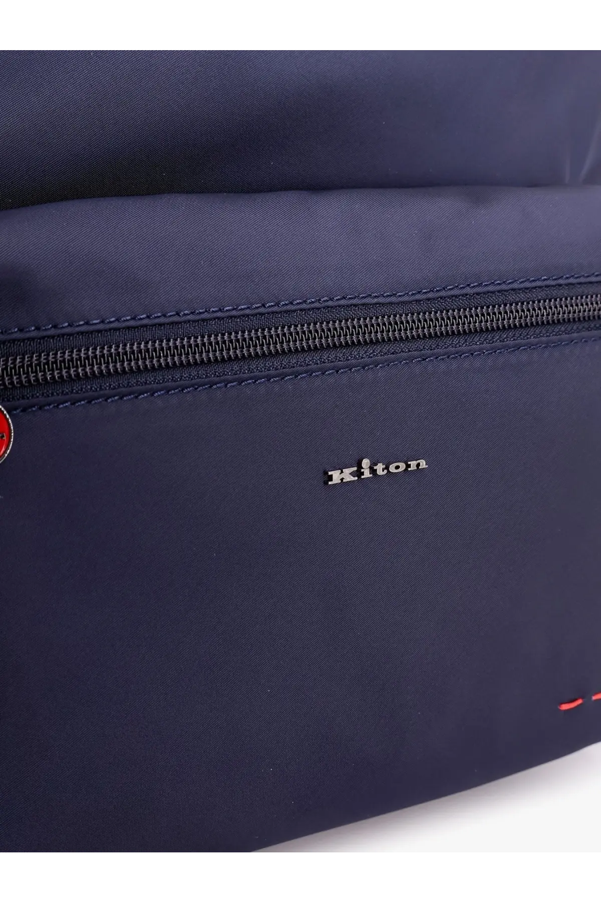 Kiton men’s nylon backpack in navy blue with black zipper and subtle red stitching accents visible from the front
