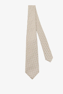 Beige Kiton men’s silk tie with subtle lighter geometric pattern made from smooth silk for formal wear