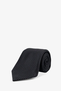 Kiton men’s silk tie in black woven silk with a subtle textured pattern for formal wear