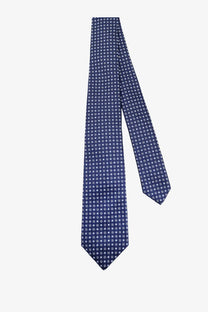Kiton men’s silk tie in navy blue with a subtle pattern of small white squares for formal wear