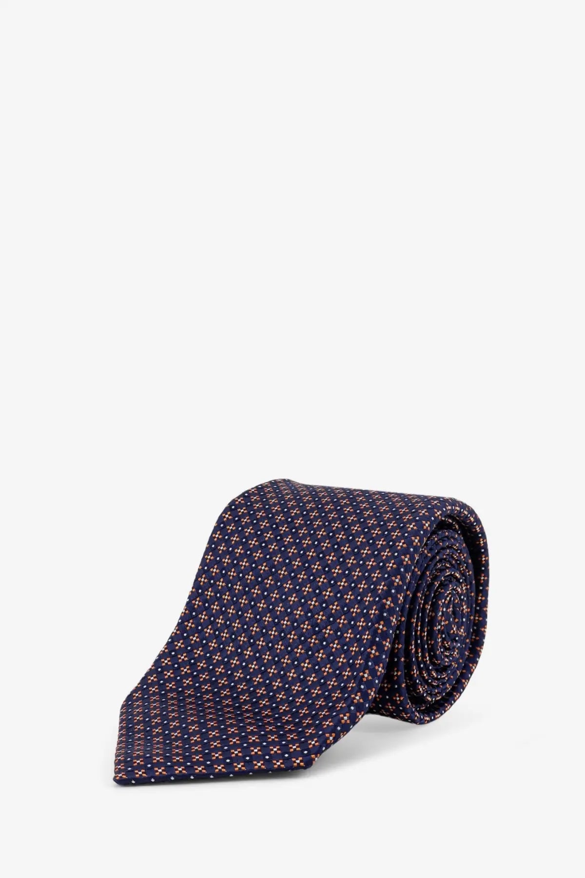 A navy blue silk tie with a subtle geometric pattern in muted pink and white from Kiton men’s multicolor collection