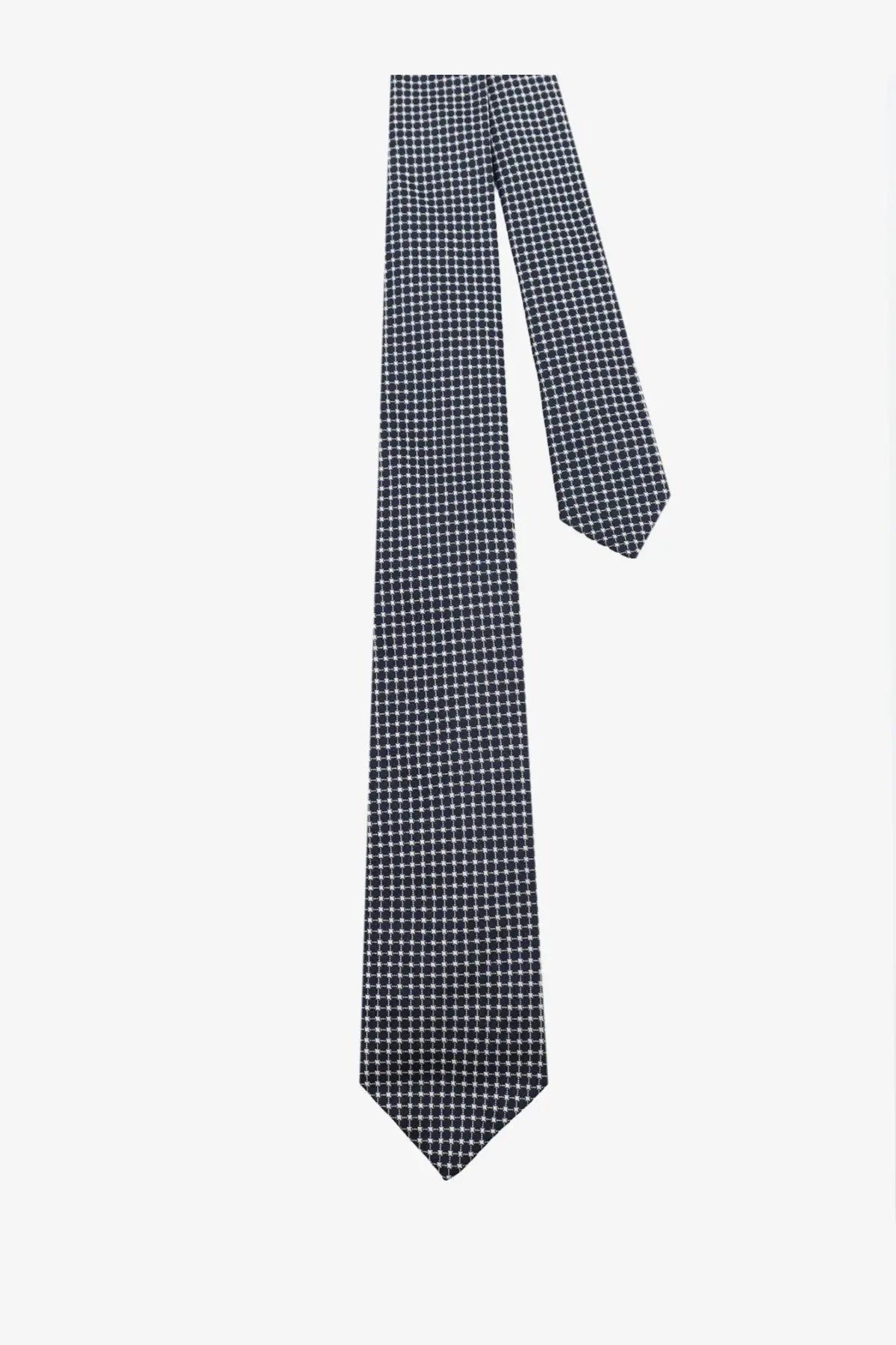 A navy blue Kiton men’s silk tie with a subtle white dot pattern made from smooth silk fabric