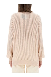 Beige ribbed knit cashmere sweater with a relaxed fit and long sleeves by Kiton women’s collection