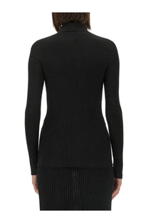 Black ribbed knit turtleneck sweater with long sleeves from Kiton womens collection made of soft fabric