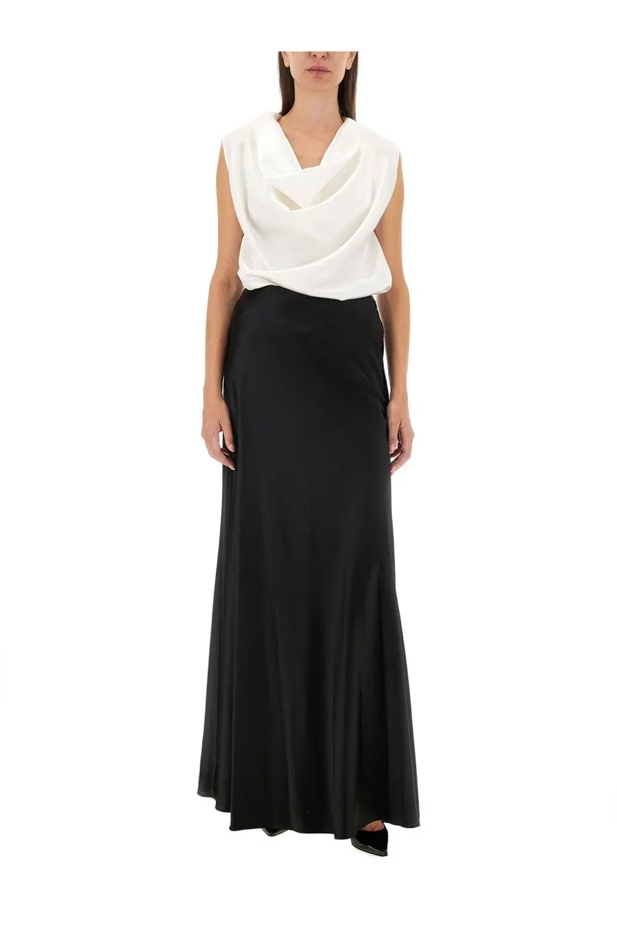 Kiton women’s shirt white paired with a sleek black satin maxi skirt featuring a smooth flowing drape and high waistline