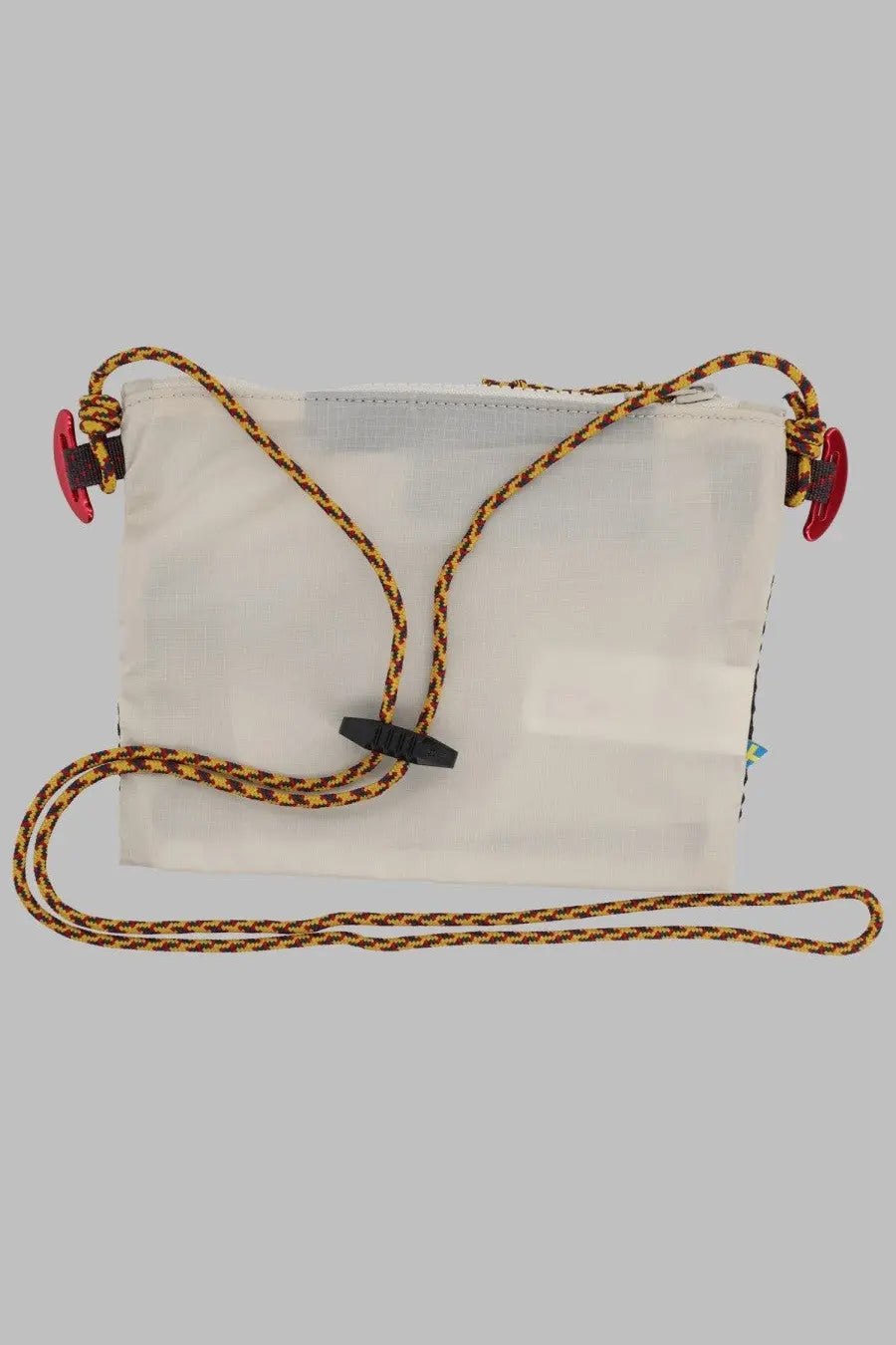 Klättermusen women’s borsa algir small white transparent crossbody bag with yellow and black braided rope straps and red clips