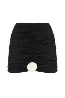 La Reveche women’s gonna Lillibet black ruched mini skirt with prominent white circular button at the front