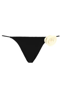 Black thong bikini bottom with cream fabric rose embellishment on the side from la reveche women’s slip bikini ashar black
