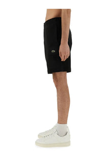 Lacoste men’s black cotton fleece cargo shorts with a subtle green crocodile logo on the side pocket