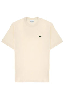 Lacoste men’s cotton short-sleeve t-shirt in cream with a small green crocodile logo on the left chest