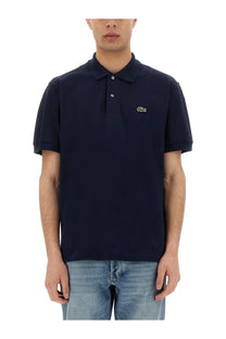 Navy blue lacoste men’s polo shirt with small green crocodile logo on left chest for casual wear