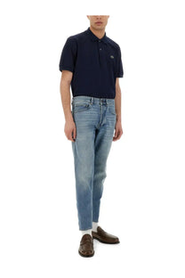 Navy blue Lacoste men’s polo shirt featuring a small embroidered crocodile logo on the left chest
