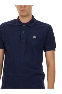 Lacoste men’s navy blue polo shirt with green crocodile logo and white buttons on the left chest