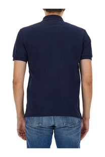 Navy blue short-sleeved cotton polo shirt for men by Lacoste suitable for casual and semi-formal wear