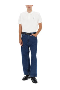Lacoste men’s white polo shirt with small embroidered crocodile logo on left chest for casual wear
