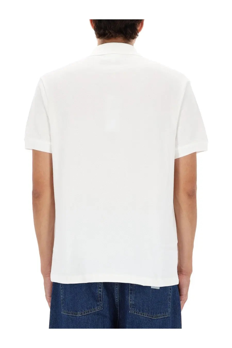 Lacoste men’s white polo shirt with short sleeves and classic collar featuring a minimalist design
